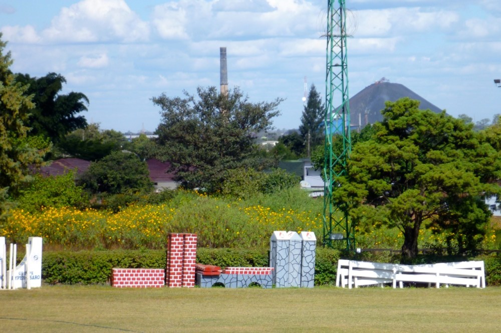 "Mount Lubumbashi"—the slag pile from an old copper smelter—with the horse-riding grounds of the Equestrian Club in front.
