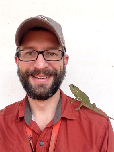 (Sept 2014) Seb made a new friend at the office, scaring the pants off every Congolese who came near. (No idea why they're afraid of chameleons, but they are.)
