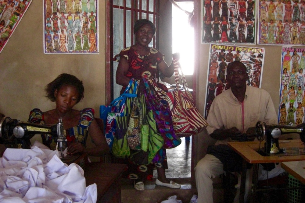 Later in 2011 I took the other ladies to meet the tailors, and we've been giving them business (dresses, purses, bags, etc.) ever since. (This woman in particular has a beautiful face that reminds me of my grandma...)