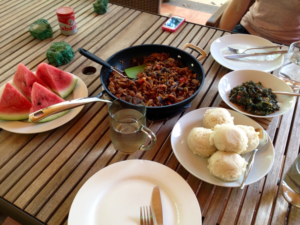 fufu with lenga-lenga, the dried fish, and watermelon, which is a rare find around here -- Viviane had never had it before