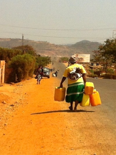 Heading to the well, water jugs in tow.