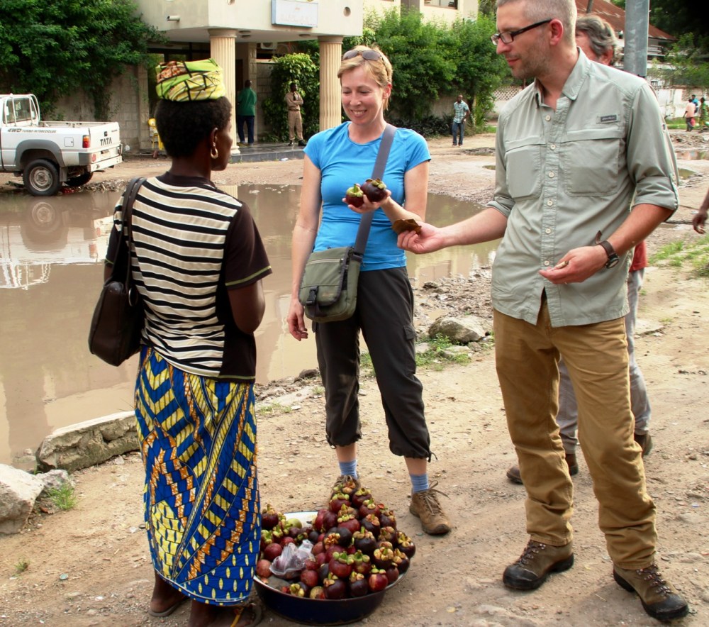 A photo from our friends Colleen & Ross, of us buying mangosteens.