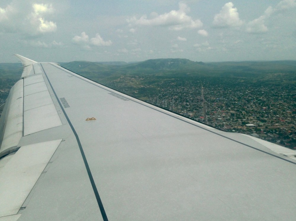 First impressions of the city as seen from the air: lots of pretty hills all around, lots of trees, long wide streets, doesn’t look bad at all. (These impressions would turn out to be both true and false.) On the other side of the plane we could spot our reason for coming: The Congo River!